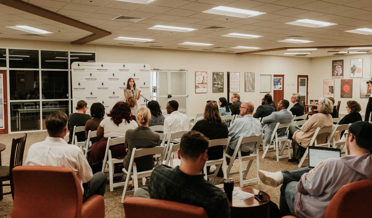 Stephanie Stuckey speaking in the library for the student q and a
